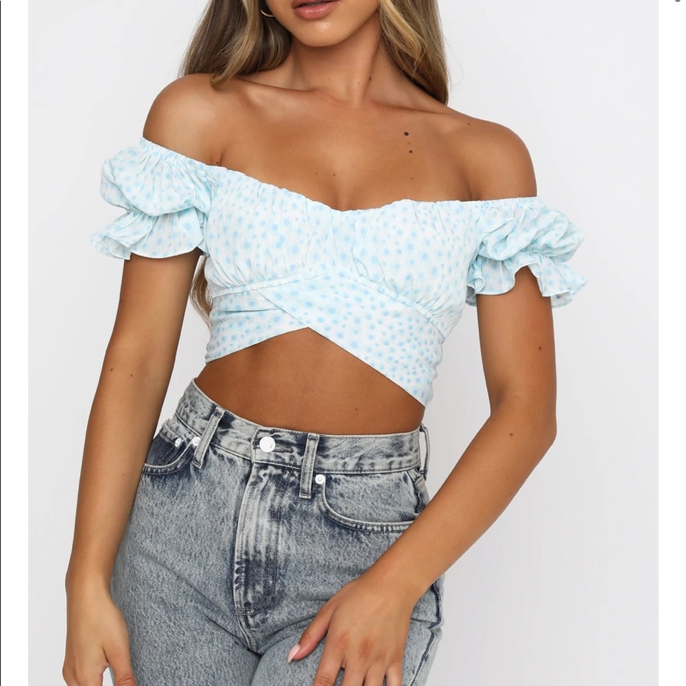 Light blue wrap top.